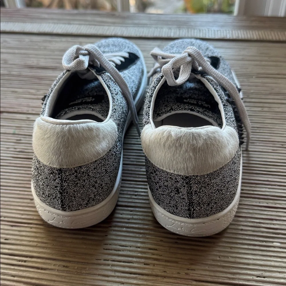 Lola Cruz silver metallic sneakers with a black raised star